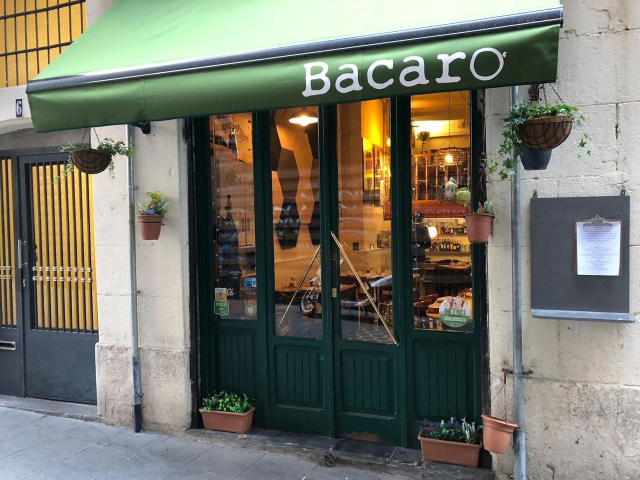 The green awning and glazed doors of Bacaro, behind La Boqueria