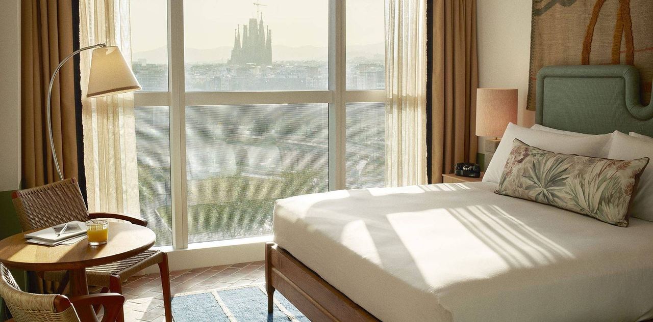 A bedroom at The Hoxton, Poblenou, with the Sagrada Família in the window
